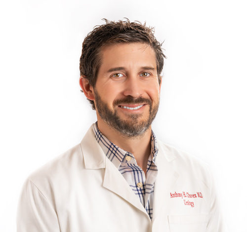 Dr. Anthony Chavez in white coat